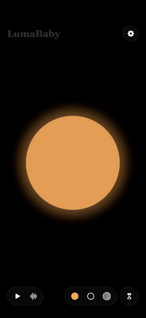 LumaBaby on iPhone: a warm orange glow on a black screen, with sound, colour, and sleep timer controls.
